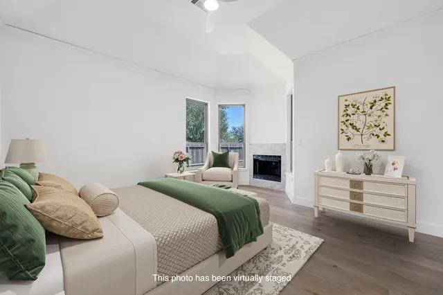 a bedroom with a bed and a fireplace