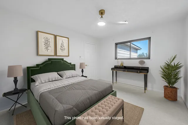 a bedroom with a bed and a couch