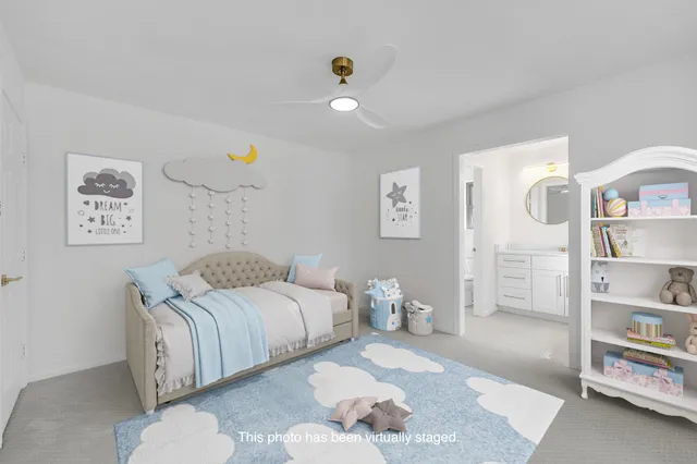 a bedroom with bed and a cabinets