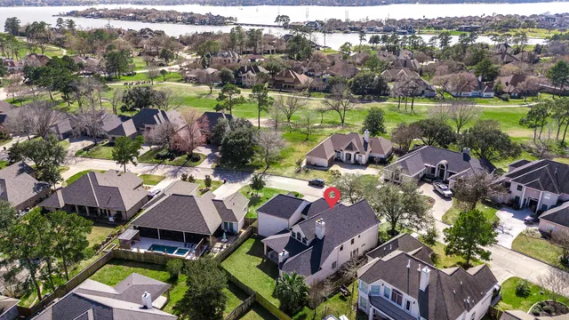 an aerial view of house with yard swimming pool and outdoor seating