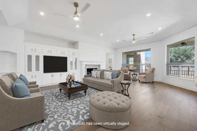 a living room with furniture or couch and a flat screen tv