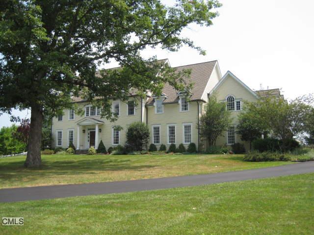 300 Ridgebury Road Ridgefield, CT 06877 - Photo 1 of 1 a front view of a house with a garden