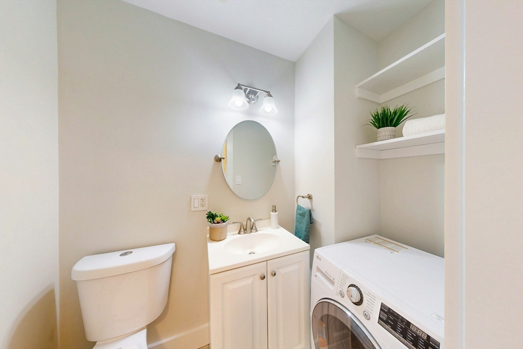 80 Newton Street, Unit 2 Somerville, MA 02143 - Photo 7 of 9 a utility room with dryer and washer