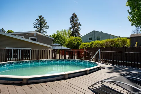 a view of a swimming pool with a patio