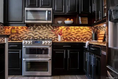 a kitchen with a stove and a microwave