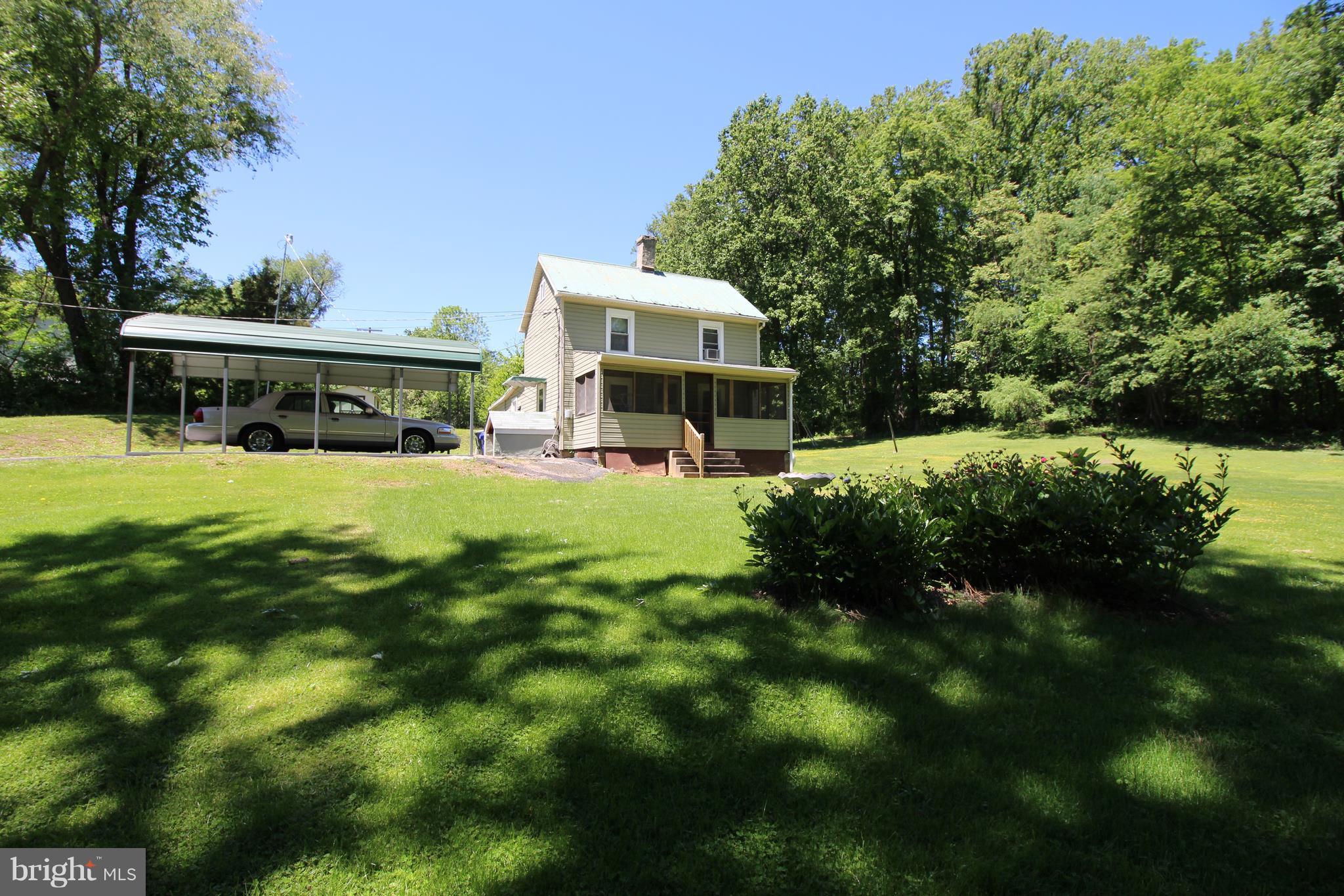 18511 Jerusalem Church Road Poolesville, MD 20837 - Photo 1 of 12 a view of a house with a yard porch and sitting area