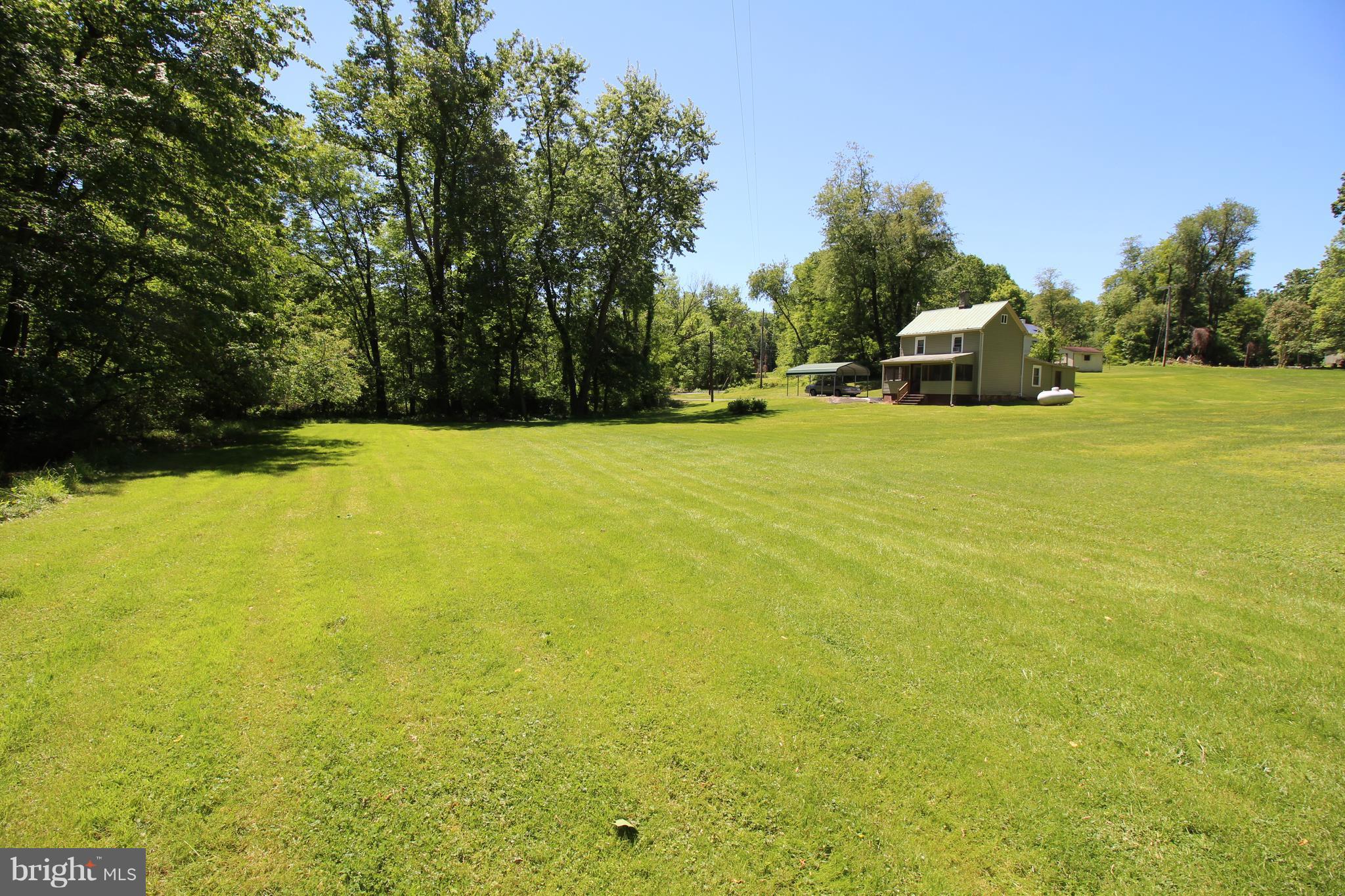 18511 Jerusalem Church Road Poolesville, MD 20837 - Photo 2 of 12 a view of a big yard with an trees
