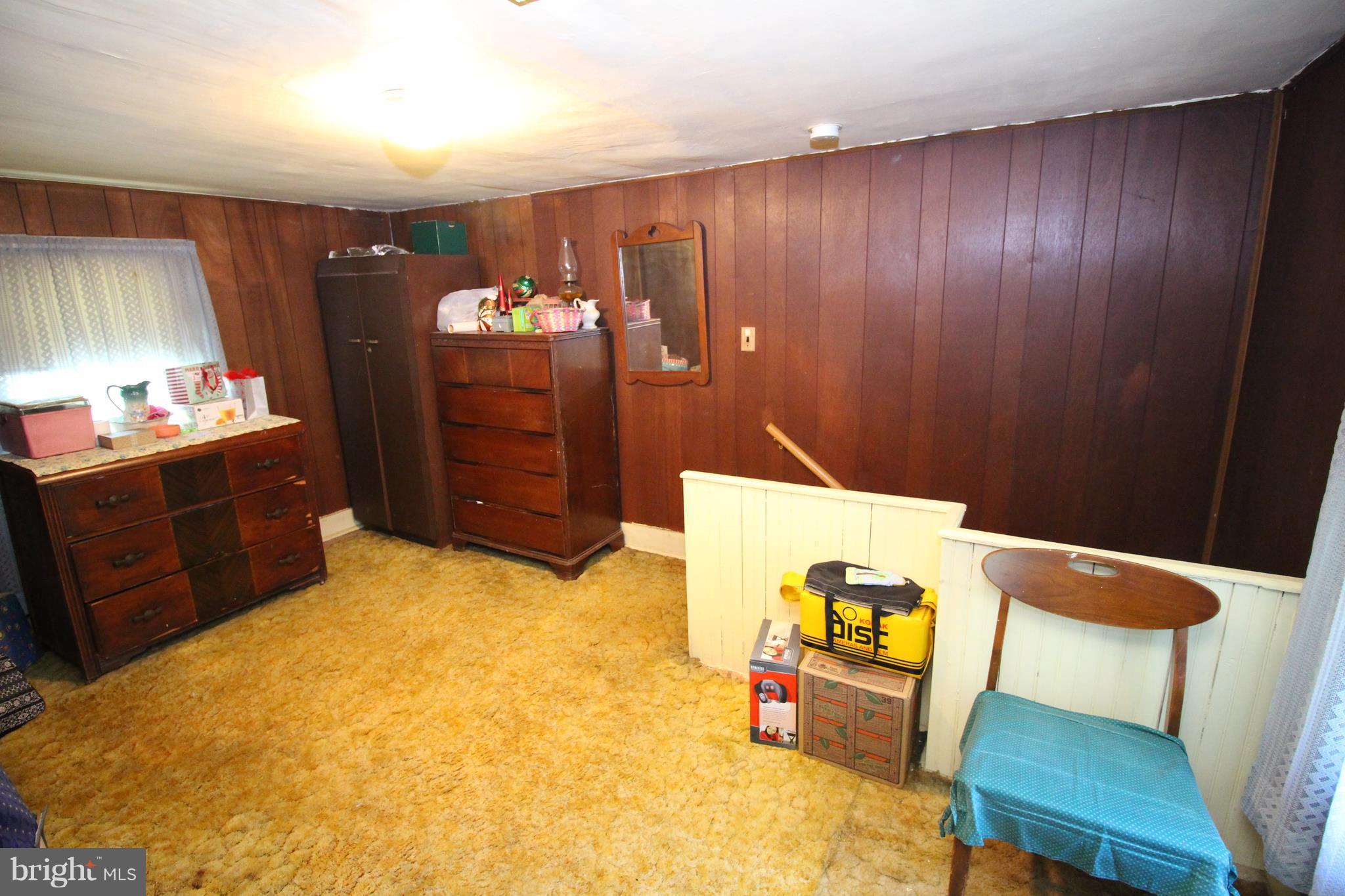 18511 Jerusalem Church Road Poolesville, MD 20837 - Photo 11 of 12 a bed room with a bed and furniture