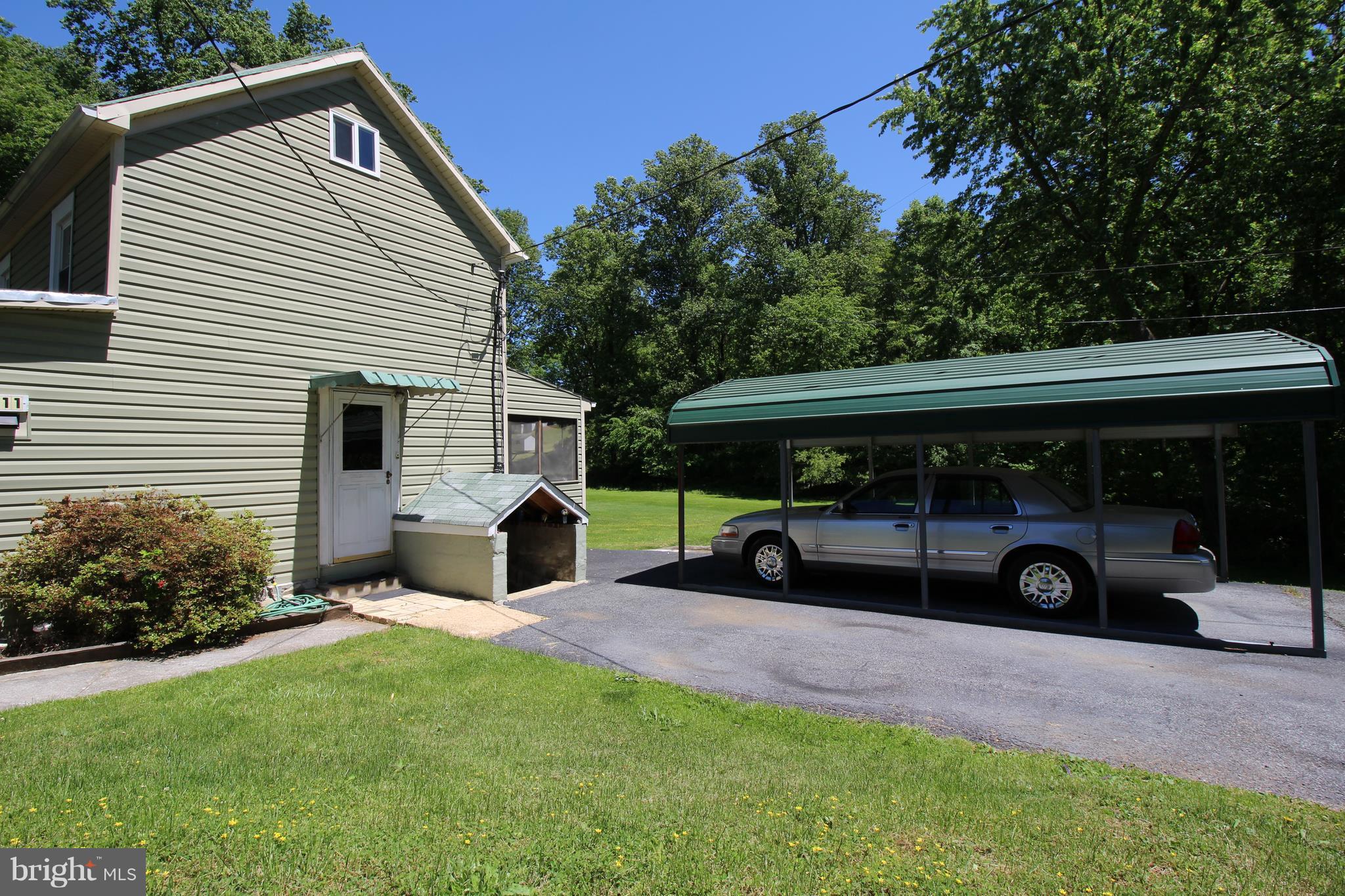 18511 Jerusalem Church Road Poolesville, MD 20837 - Photo 3 of 12 a view of an house with backyard space and garden