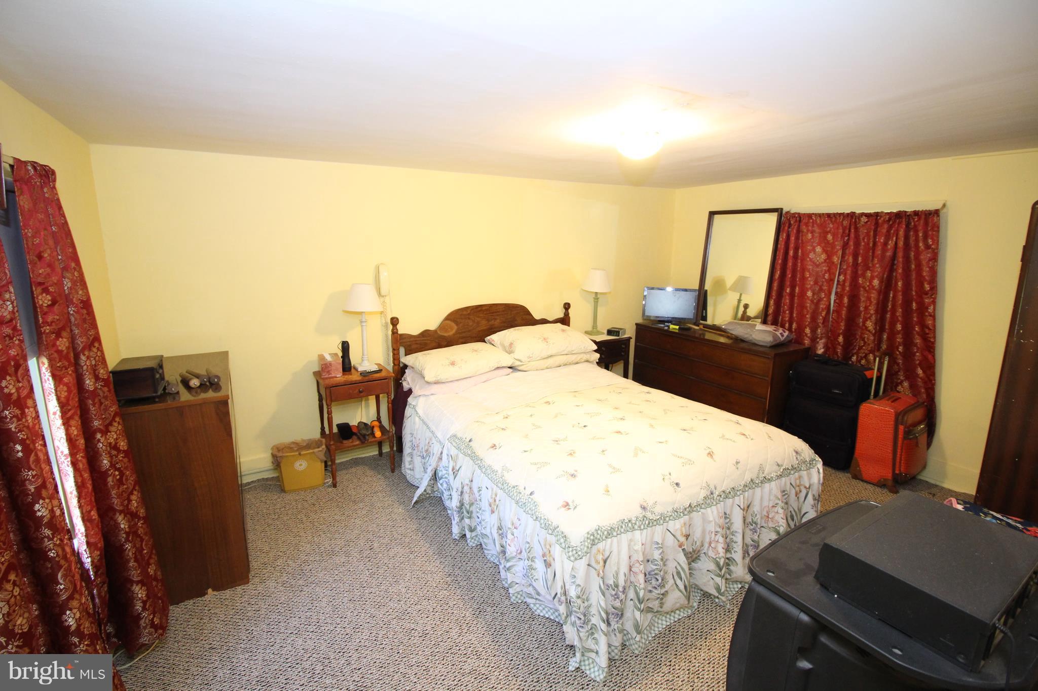 18511 Jerusalem Church Road Poolesville, MD 20837 - Photo 9 of 12 a bedroom with a bed and wooden floor
