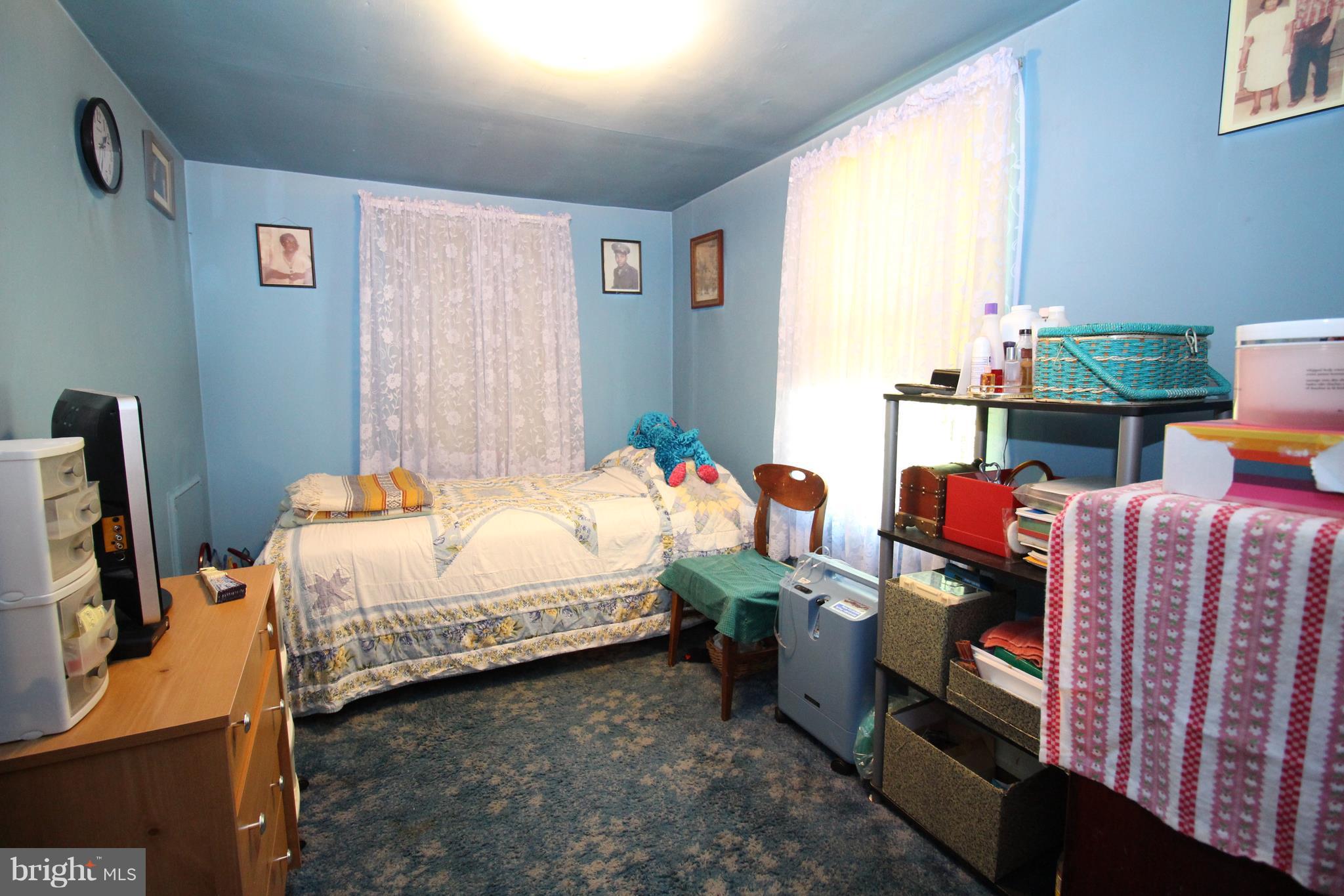 18511 Jerusalem Church Road Poolesville, MD 20837 - Photo 10 of 12 a bed room with a bed and a chair