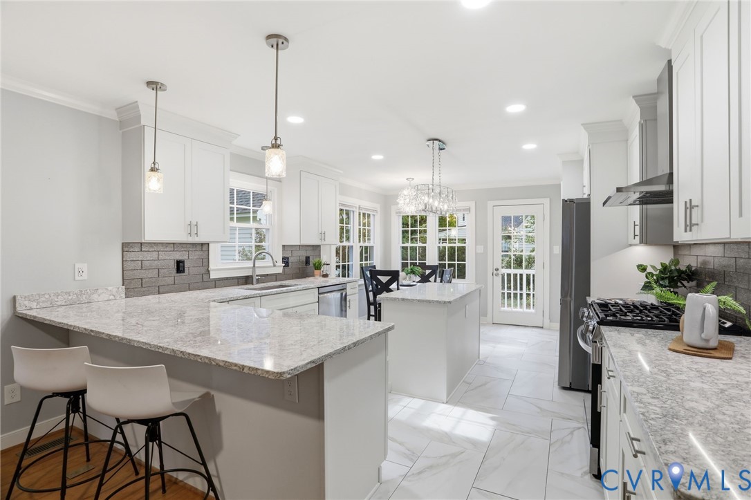9806 Old Cannon Road North Chesterfield, VA 23237 - Photo 12 of 46 Bar seating in renovated kitchen.