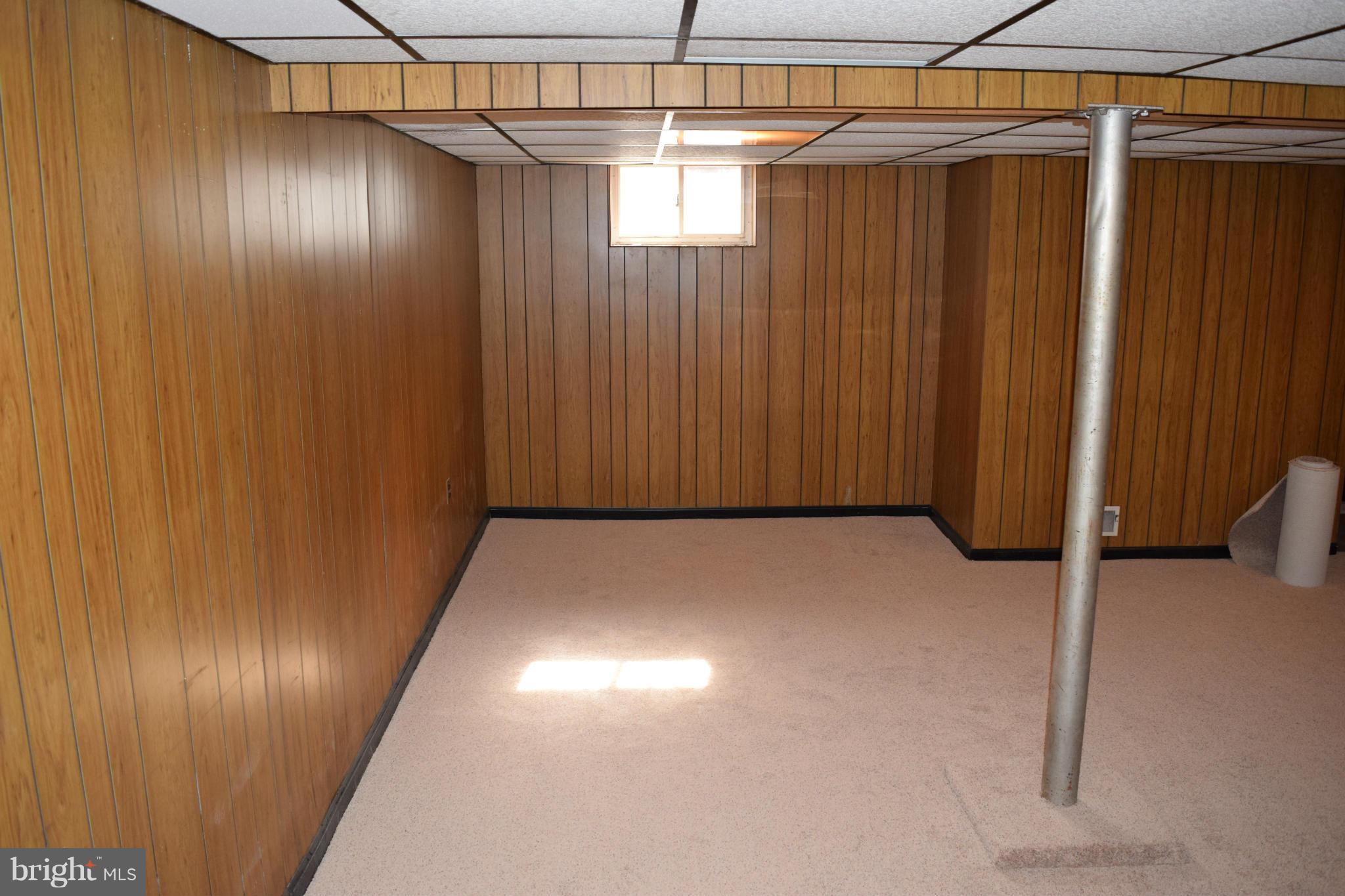 314 Worton Road Baltimore, MD 21221 - Photo 23 of 30 a view of an empty room with wooden walls