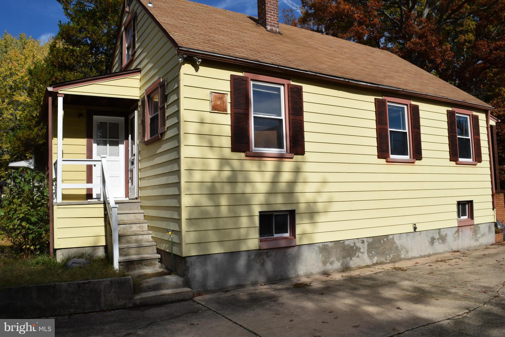 314 Worton Road Baltimore, MD 21221 - Photo 6 of 30 a front view of a house with a yard