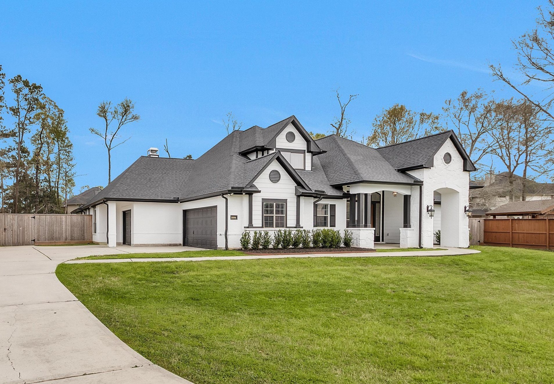 10004 Summer Ridge Lane Conroe, TX 77302 - Photo 3 of 50 a front view of house with yard and green space