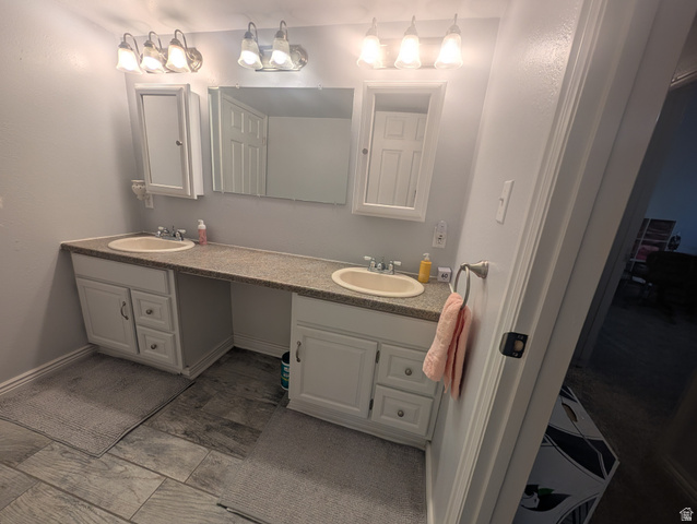 897 East 1200 North Mapleton, UT 84664 - Photo 49 of 54 Full bathroom with double vanity and baseboards