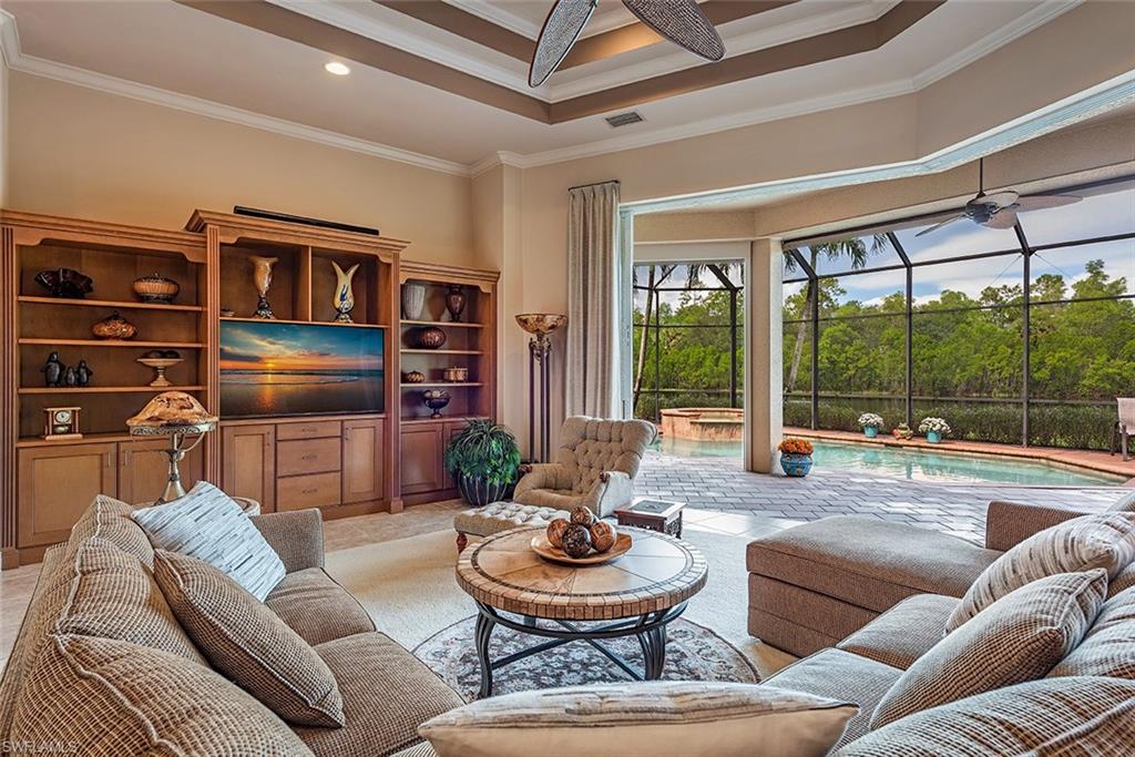 1749 Supreme Court Naples, FL 34110 - Photo 2 of 18 a living room with furniture and a large window