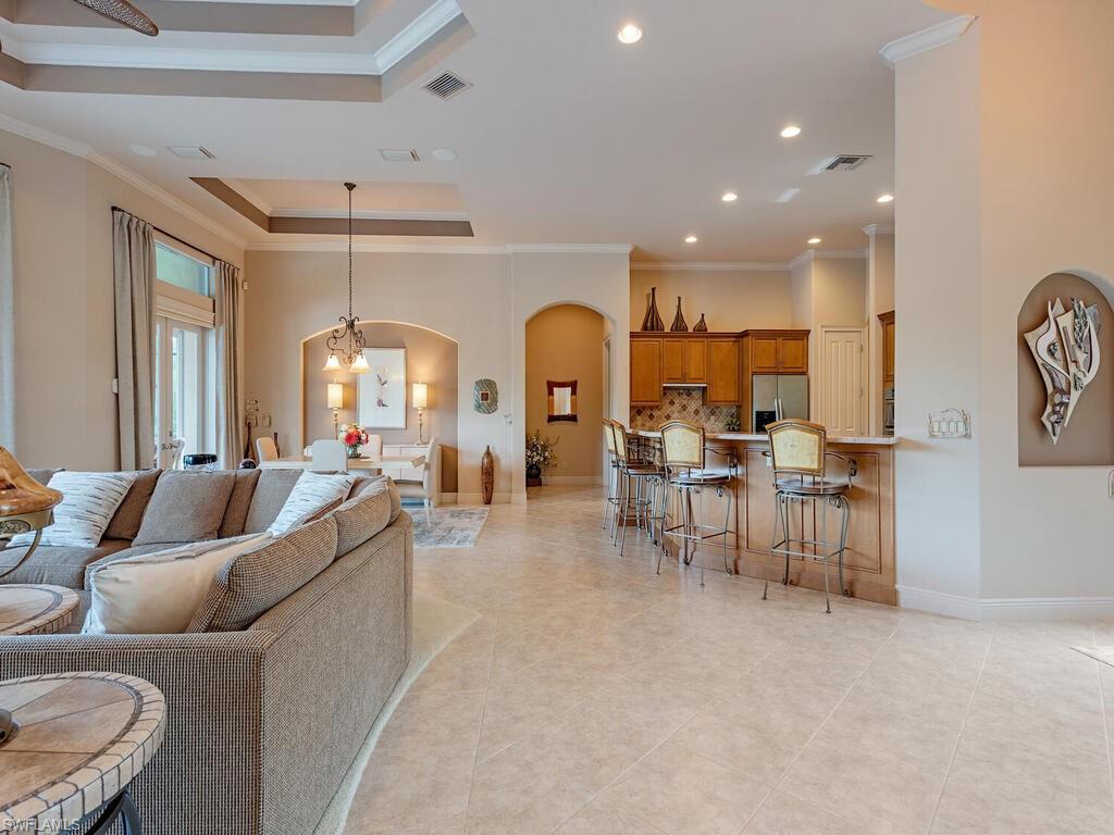 1749 Supreme Court Naples, FL 34110 - Photo 4 of 18 a living room with furniture and a large window