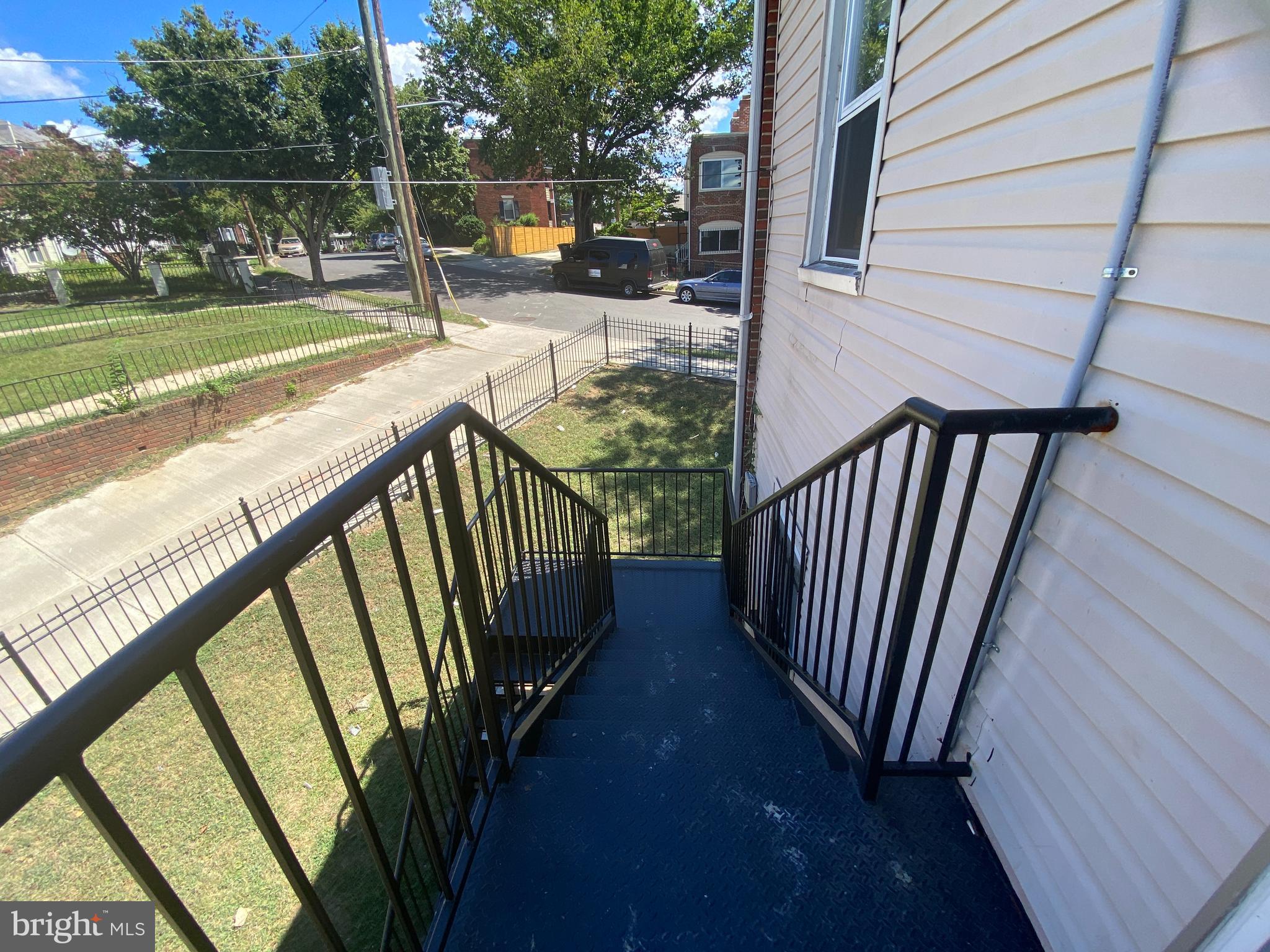 1324 Adams Street Northeast Washington, DC 20018 - Photo 20 of 22 a view of balcony with wooden floor and fence