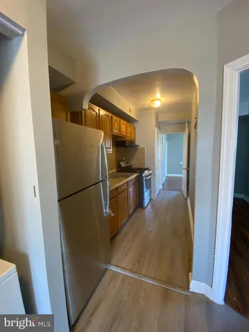 a view of a kitchen from the hallway