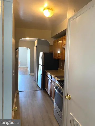 a view of a kitchen cabinets and a stove