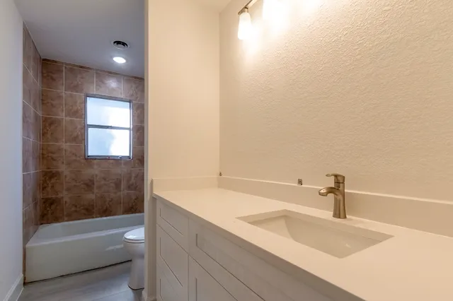 a bathroom with a sink and a bathtub