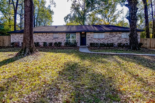 a view of swimming pool with a patio
