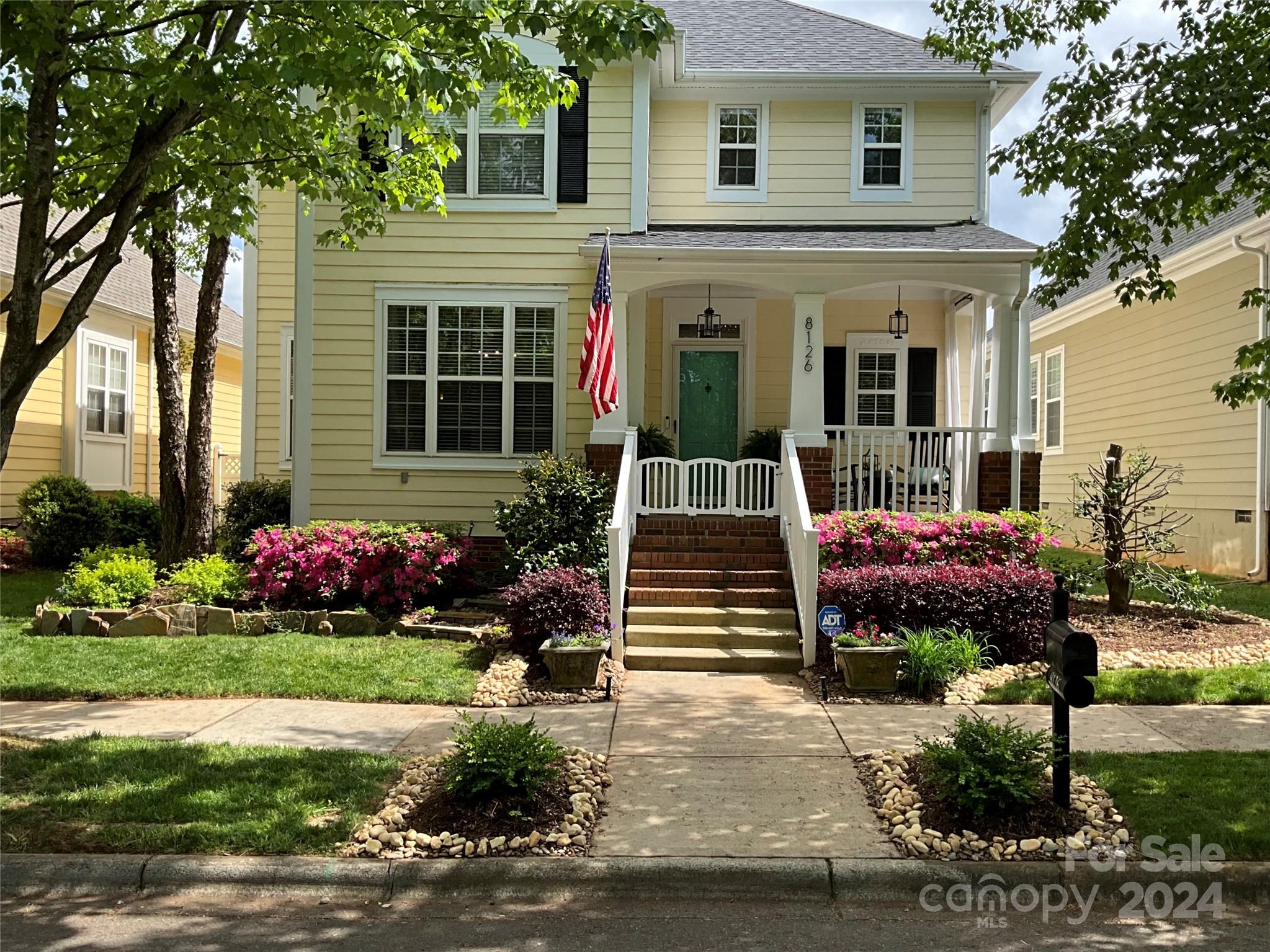 front view of a house with a yard
