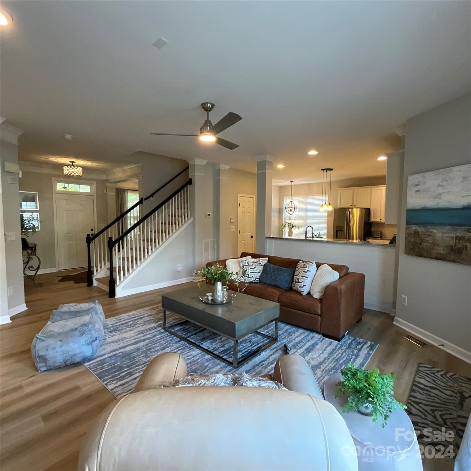 8126 Evanston Falls Road Huntersville, NC 28078 - Photo 11 of 42 a living room with furniture and a wooden floor