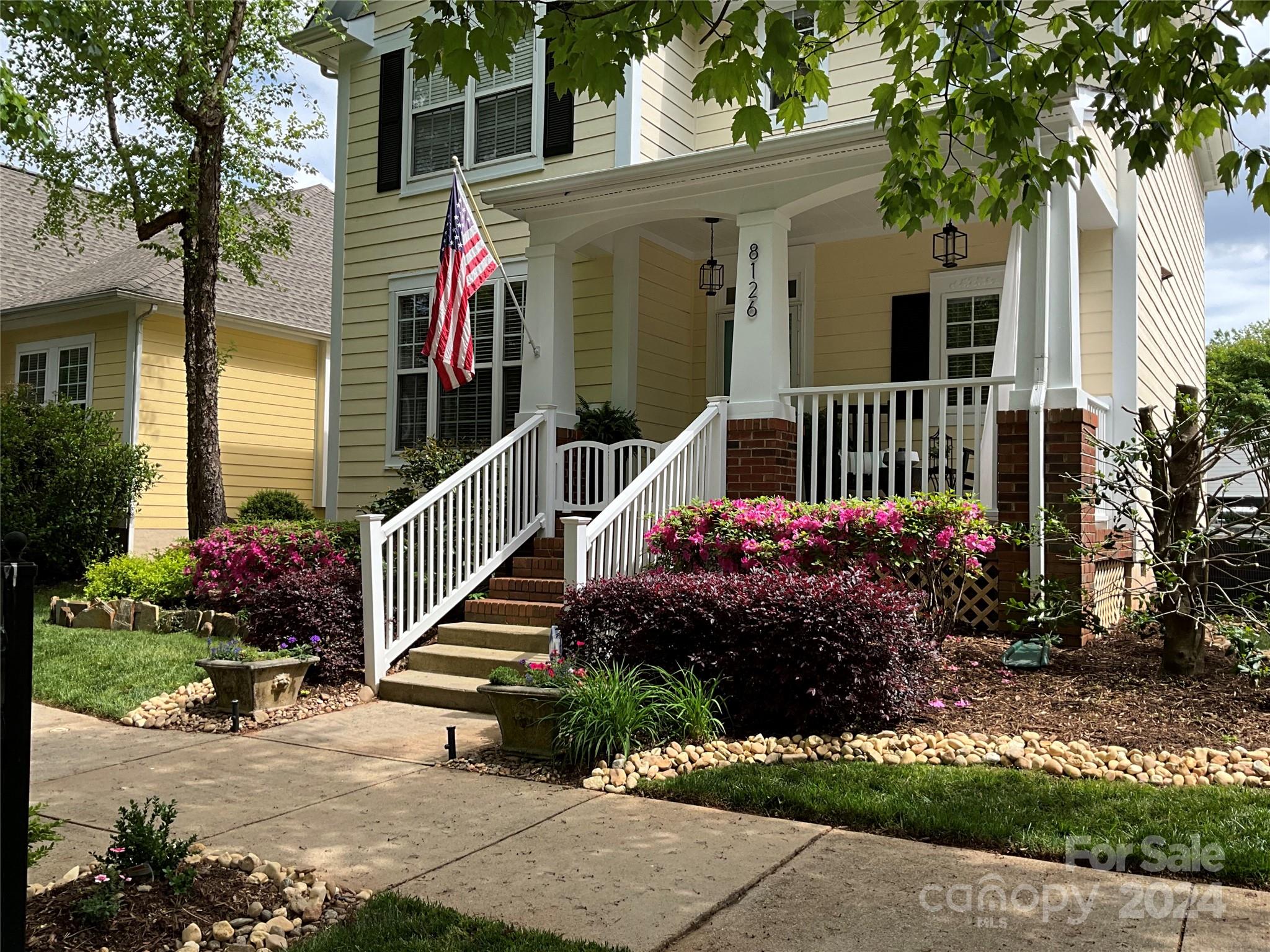 8126 Evanston Falls Road Huntersville, NC 28078 - Photo 2 of 42 a front view of a house having yard