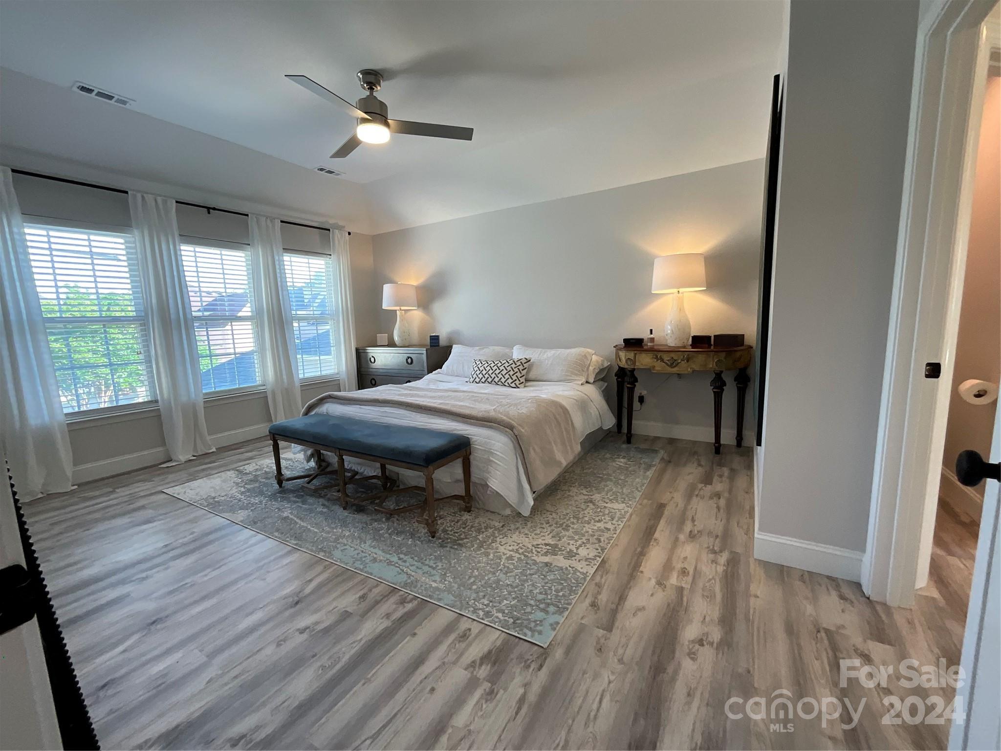 8126 Evanston Falls Road Huntersville, NC 28078 - Photo 21 of 42 a bedroom with a bed and a table