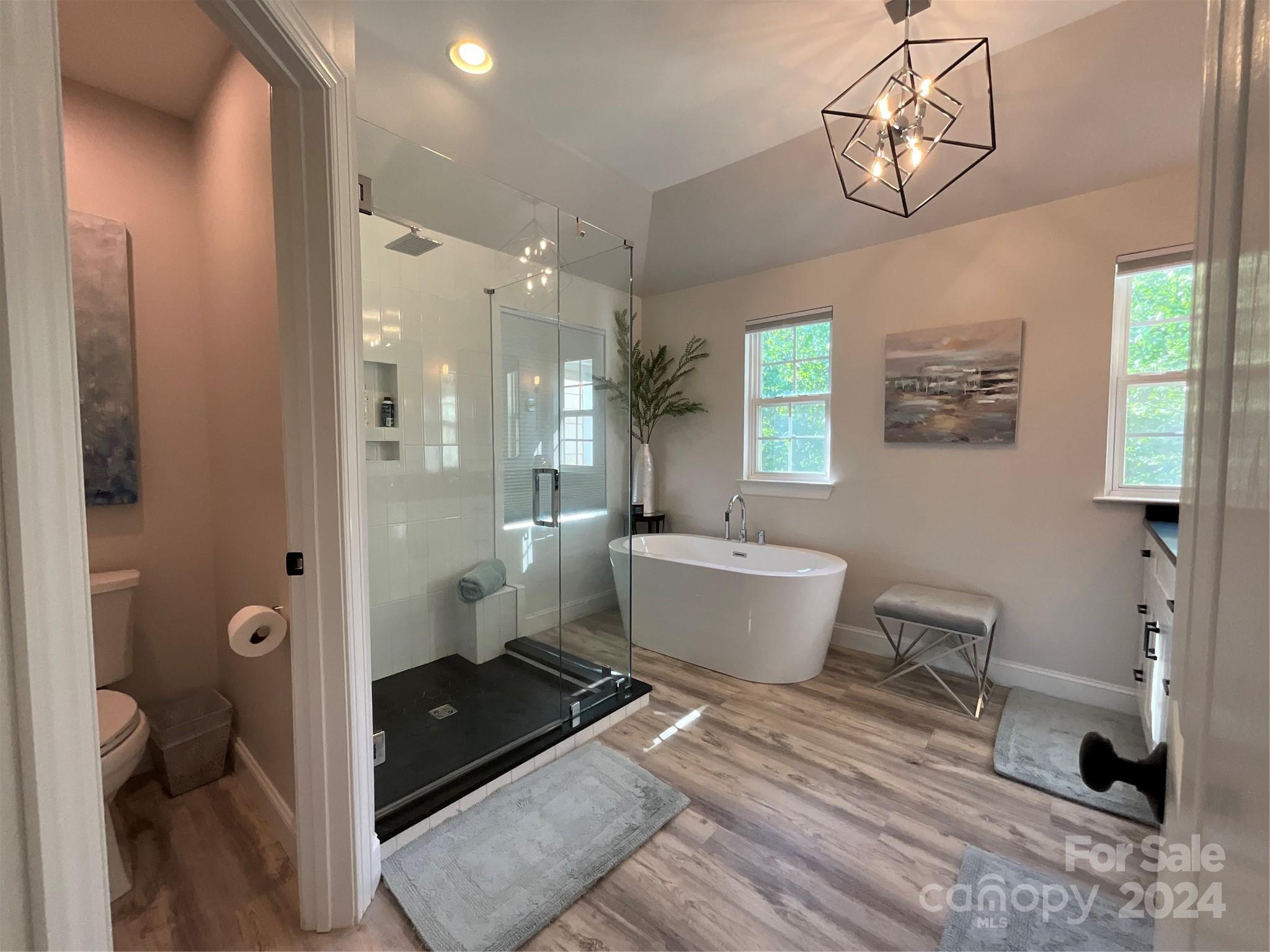 8126 Evanston Falls Road Huntersville, NC 28078 - Photo 25 of 42 a bathroom with a sink a toilet and shower