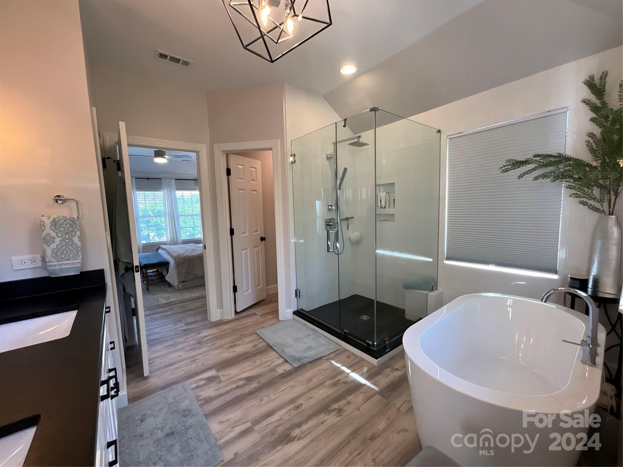 8126 Evanston Falls Road Huntersville, NC 28078 - Photo 26 of 42 a bathroom with a sink and a mirror