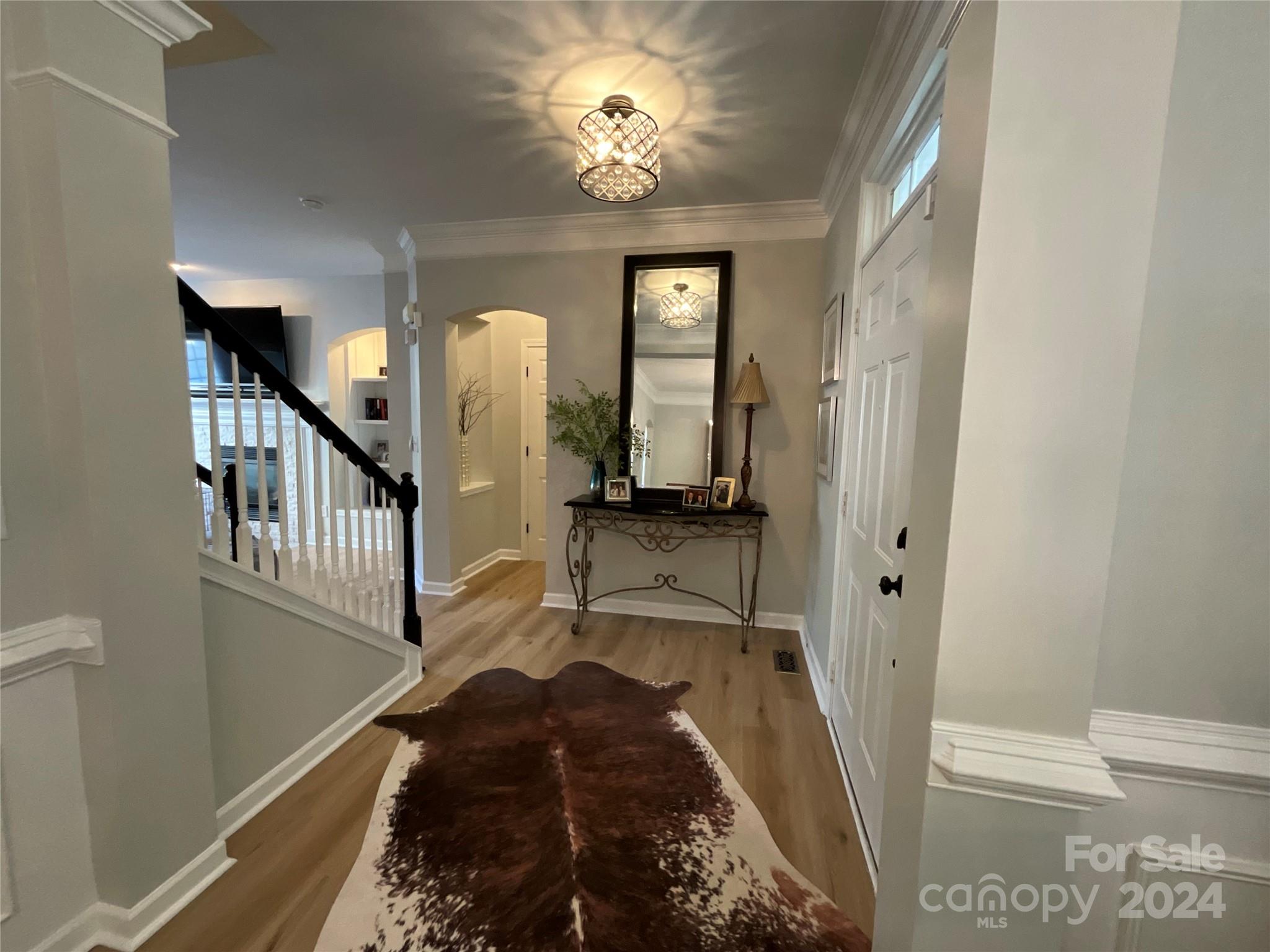 8126 Evanston Falls Road Huntersville, NC 28078 - Photo 6 of 42 a view of a hallway to a livingroom with furniture