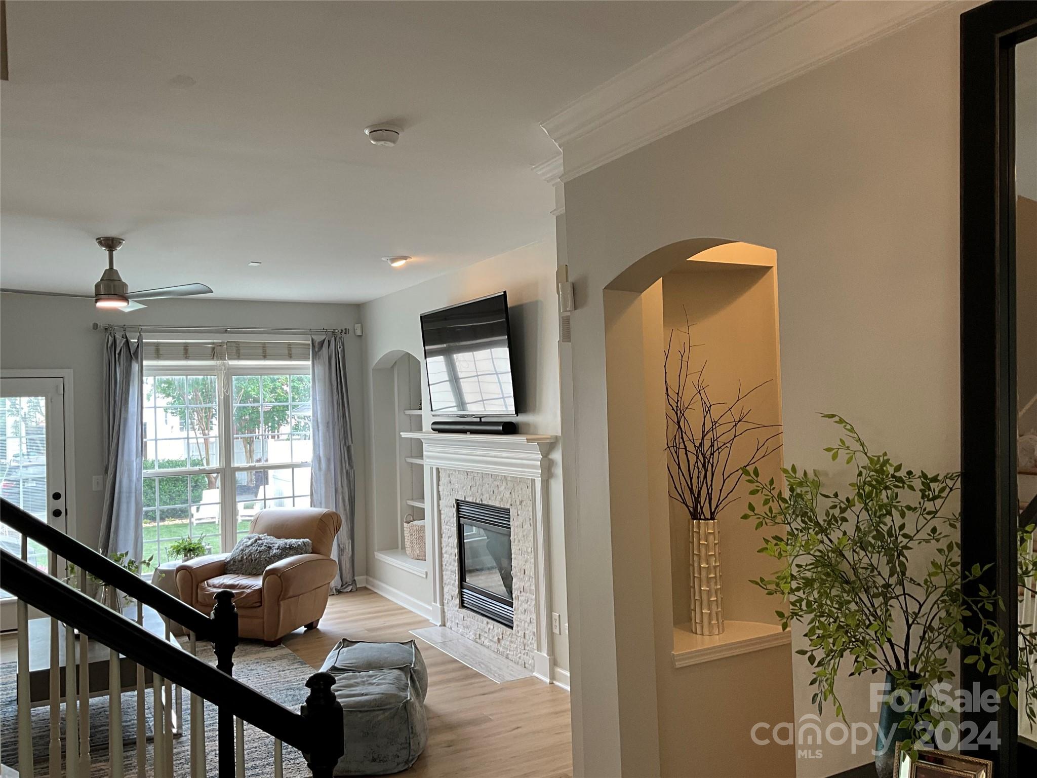 8126 Evanston Falls Road Huntersville, NC 28078 - Photo 10 of 42 a living room with furniture fireplace and flat screen tv