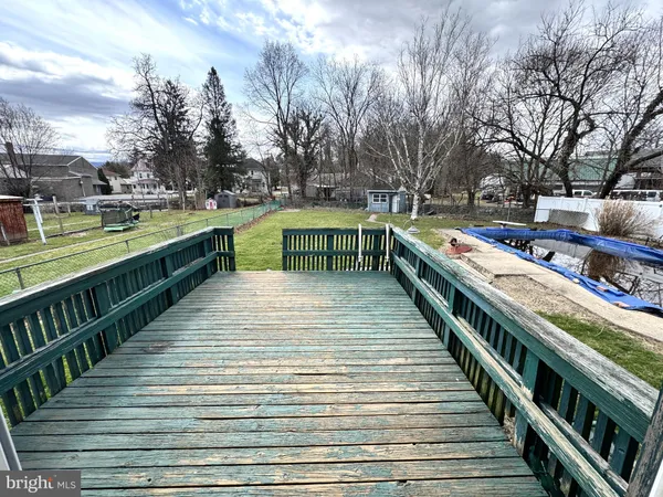 a balcony with view of outdoor space