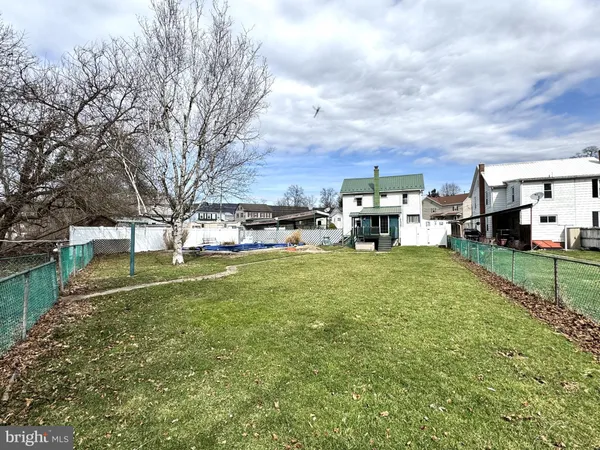 a front view of a house with swimming pool