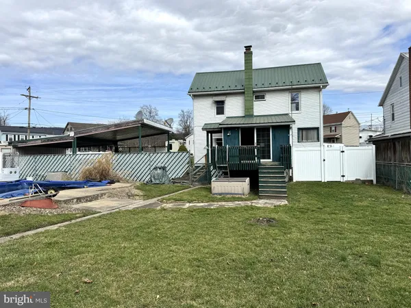a view of a house with a street