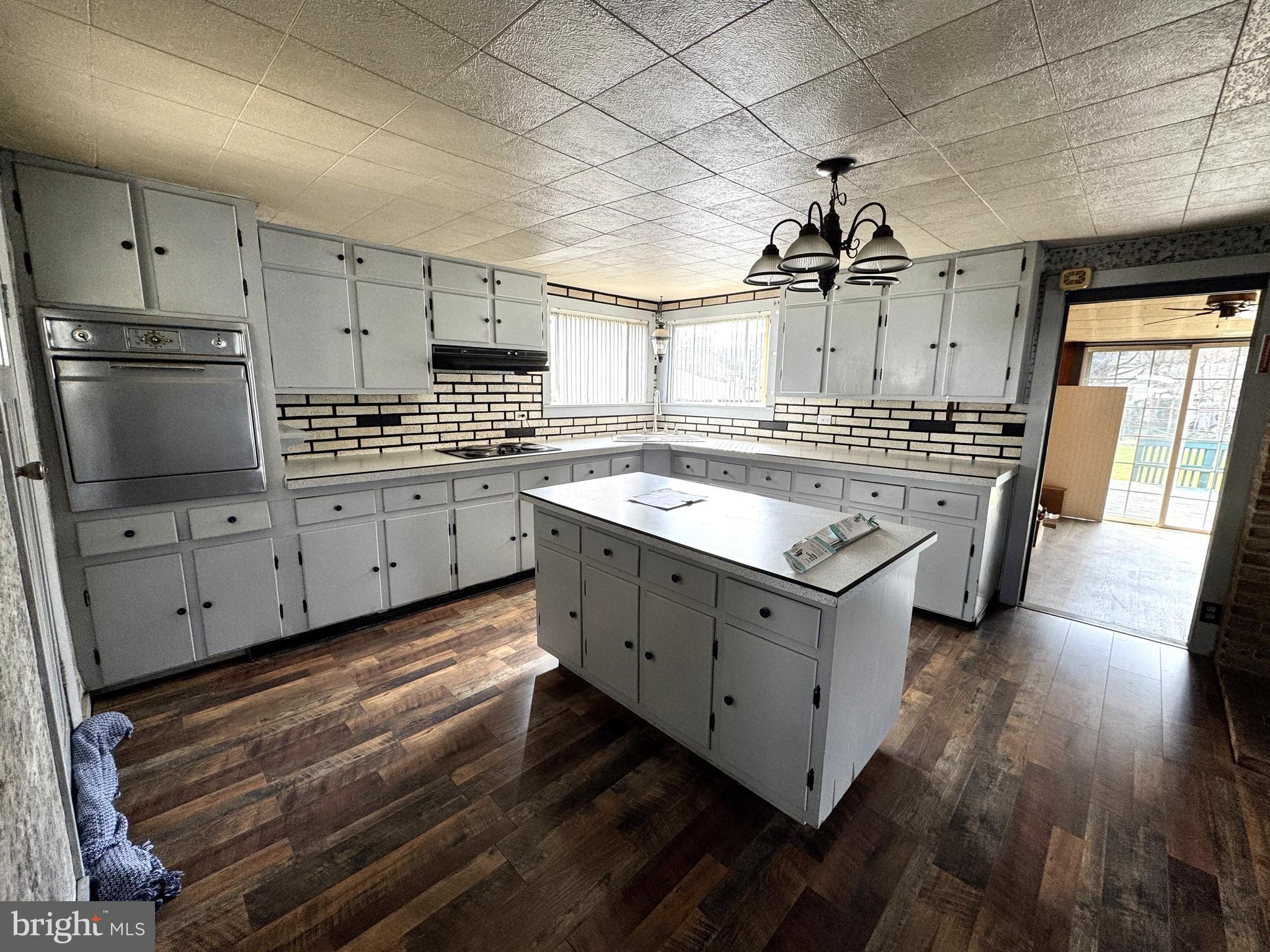 12 Maclay Street Milroy, PA 17063 - Photo 3 of 25 a kitchen with stove cabinets and wooden floor