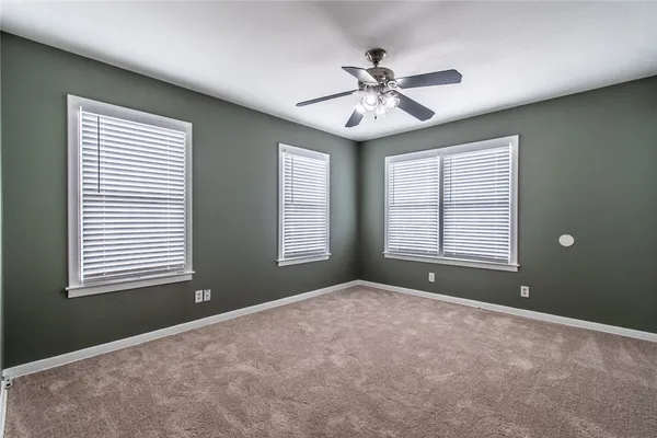 a view of an empty room with windows