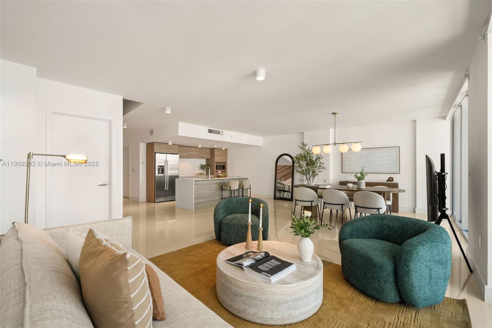 6620 Indian Creek Drive, Unit 713 Miami Beach, FL 33141 - Photo 12 of 39 a living room with furniture and a view of kitchen