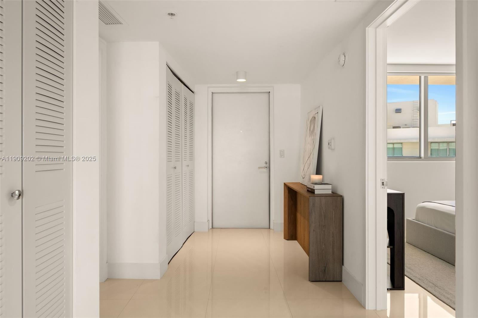 6620 Indian Creek Drive, Unit 713 Miami Beach, FL 33141 - Photo 13 of 39 a view of a hallway with furniture and windows