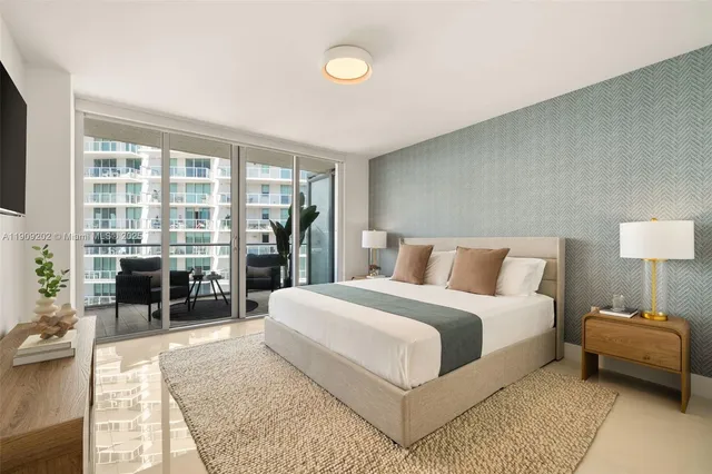 a bedroom with a large bed and a couch