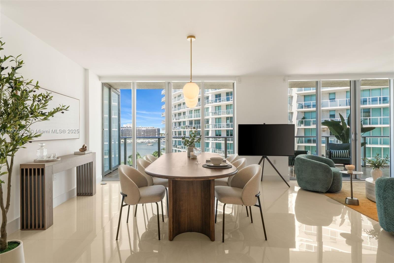 6620 Indian Creek Drive, Unit 713 Miami Beach, FL 33141 - Photo 2 of 39 a view of a dining room with furniture window and outside view