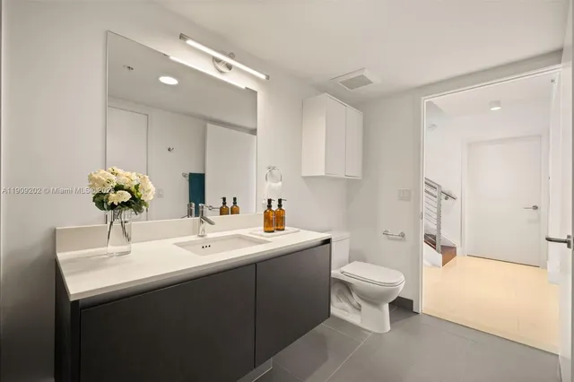 a bathroom with a sink toilet and tub