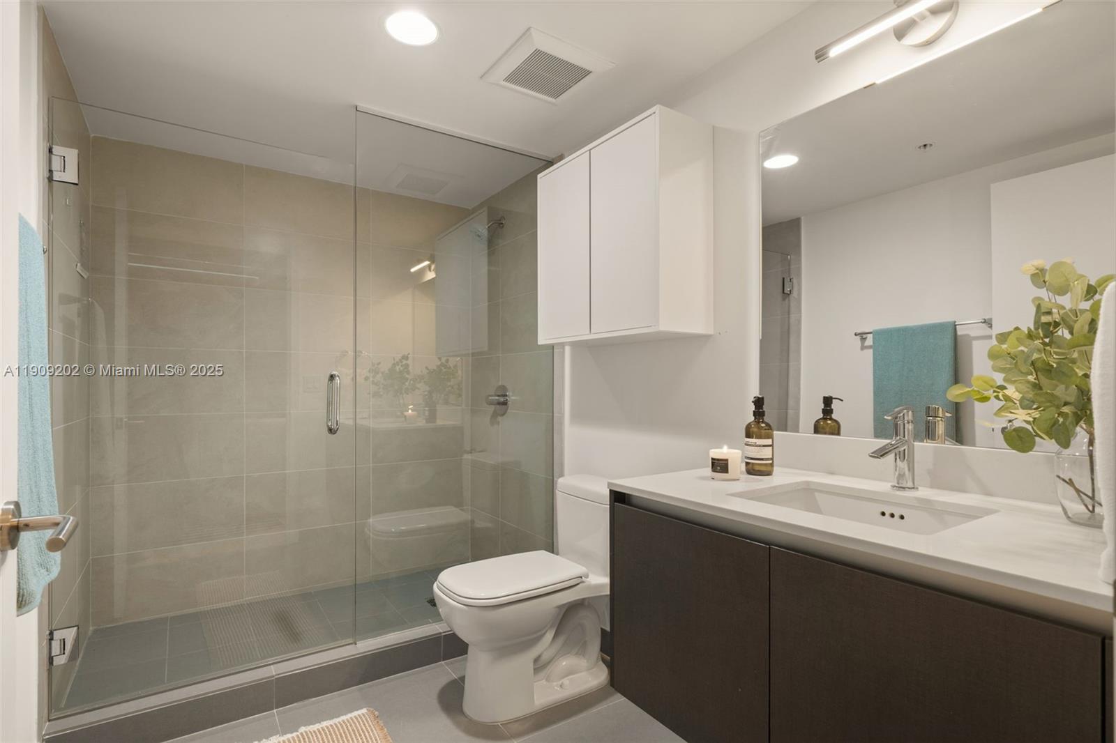 6620 Indian Creek Drive, Unit 713 Miami Beach, FL 33141 - Photo 24 of 39 a bathroom with a sink toilet and shower