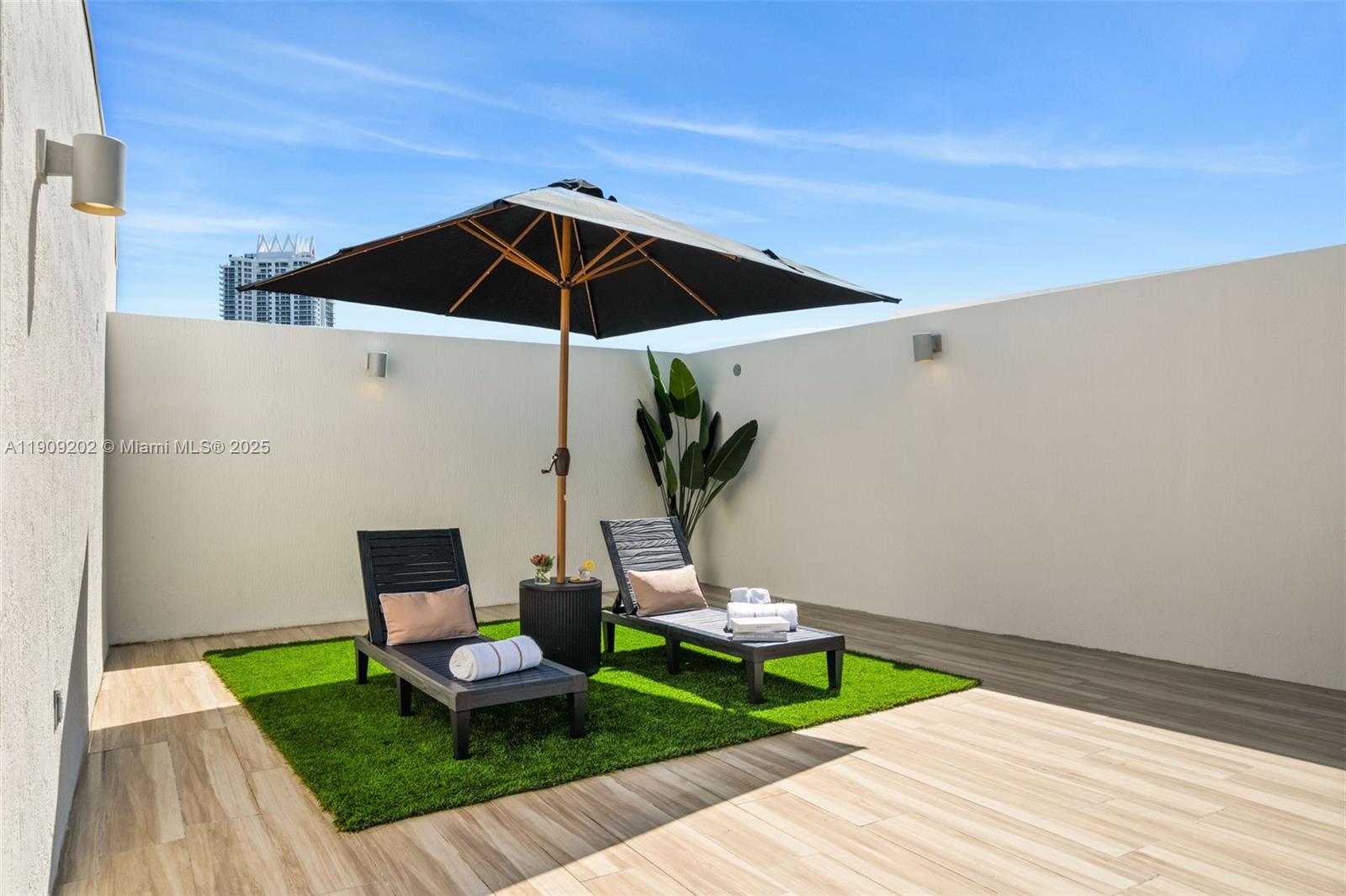 6620 Indian Creek Drive, Unit 713 Miami Beach, FL 33141 - Photo 27 of 39 a view of a patio with furniture and a table