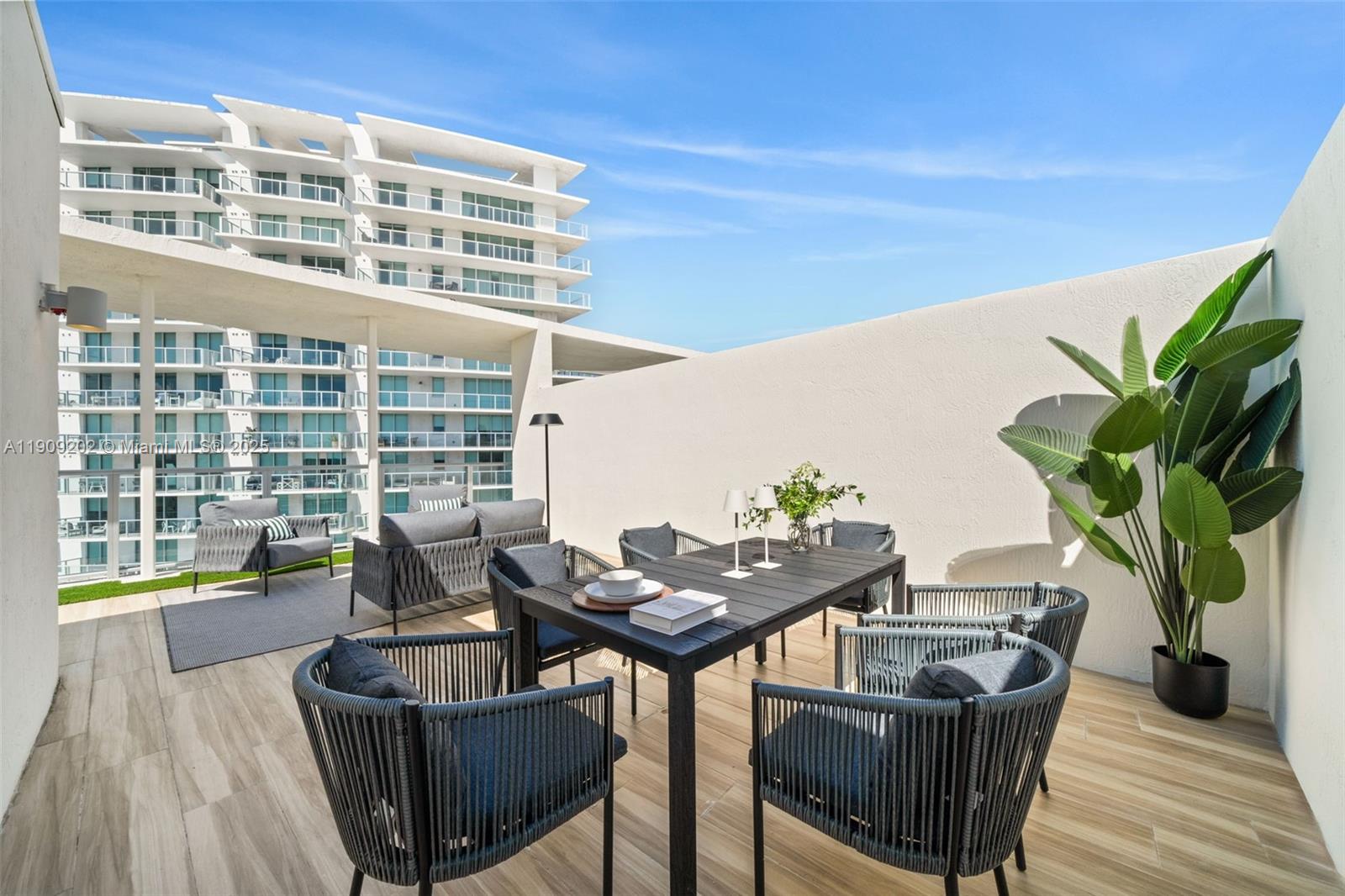 6620 Indian Creek Drive, Unit 713 Miami Beach, FL 33141 - Photo 30 of 39 a balcony with table and chairs