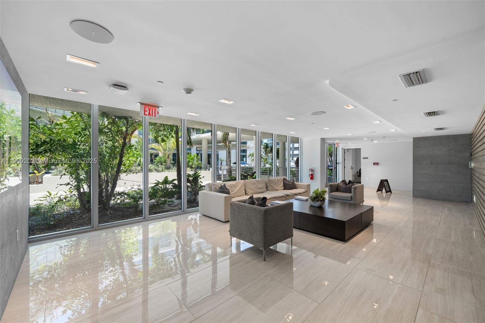 6620 Indian Creek Drive, Unit 713 Miami Beach, FL 33141 - Photo 32 of 39 a living room with furniture and a large window