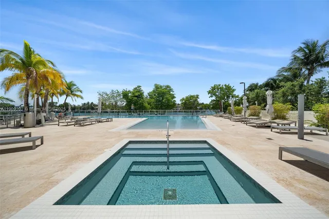 a view of swimming pool with chairs